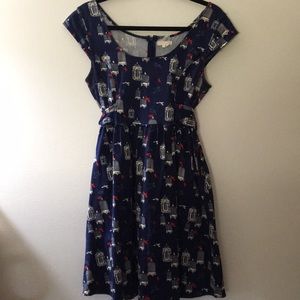 Navy cap sleeve tie back birdcage dress